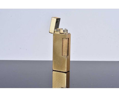 A gold plated Dunhill pocket lighter, with engine turned design to body, Patent Number RE24153, with initial G.M.G to the top