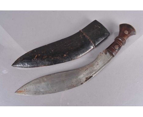 A WWI dated Kukri, stamped 1916 to the curved blade, with 443 underneath, together with turned wooden handle, with metal pomm