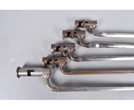Four British 1876 Pattern Socket Bayonets, all marked with the Military Issue Broad Arrow, one with unit numbers to the socke