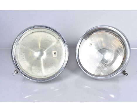 Two vintage Lucas Car Head Lamps, one with three prong 'Bullseye' design, the other with no light fitting, both with 26cm len