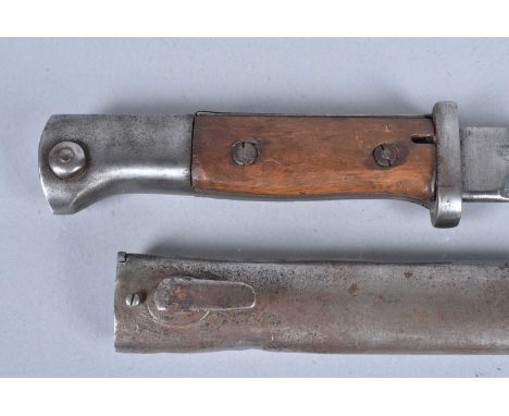 A WWI German 84/8 Sawback Bayonet, by Gottlieb, with 25cm long blade, with small stamp to the pommel, complete with scabbard