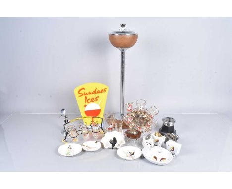 An assortment of vintage Drinking items, to include two shot glass stands with glasses, a selection of ashtrays with ladies o