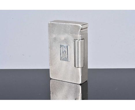 A Bach &amp; Cooper silver pocket lighter, dated Birmingham 1950, with engine turned design to all six sides, with initialled
