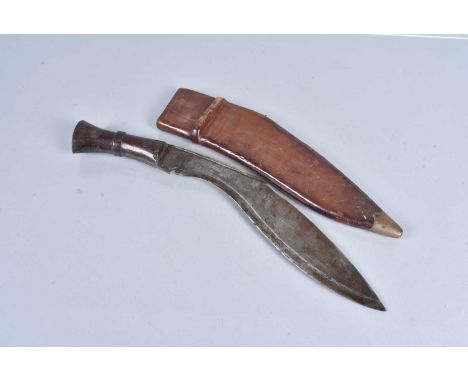 A WWII British/Indian Military Issue Kukri, dated 1945, with stamps to the leather scabbard, wooden handle with stamp to the 