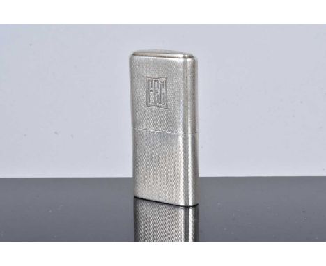 The ''Howitt'' Lighter in silver, dated Sheffield 1942, maker's stamp for Dudley Russell Howitt, curved sides, with engine tu