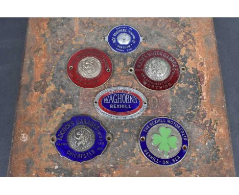Sussex, six vintage car dash badges, comprising Adcocks Garages Limited, Chichester, Wades Motor Garages, Worthing (J.R.Gaunt