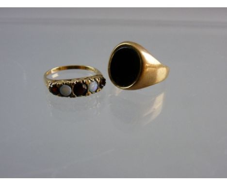 A GENT'S GOLD SIGNET RING with oval agate, 3 grms and a nine carat gold opal and garnet dress ring, 2.9 grms