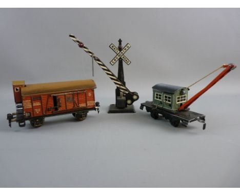 MARKLIN TINPLATE WITH OTHERS, a well liveried livestock transportation box car with domed roof, guard hut and sliding side do