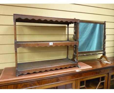 A GEORGIAN MAHOGANY THREE SHELF DISPLAY STAND with shaped apron decoration and slender turned shelf supports, 52 cms high, 62