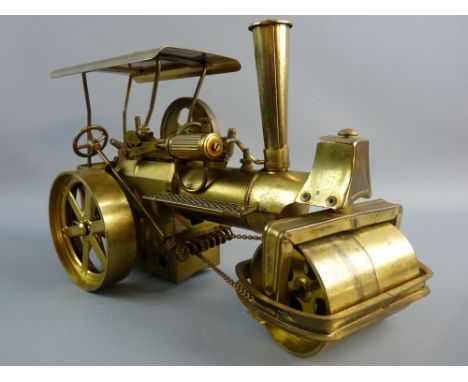 A BRASS MODEL STEAM TRACTION ENGINE, chain steered model with steam roller front, marked to the base 'Made in Western Germany