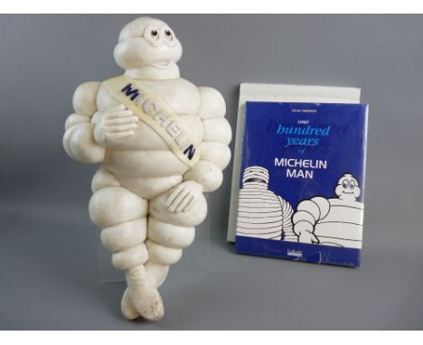 A MICHELIN MAN BIBENDUM moulded advertising figure, the seated 46 cms figure with Michelin sash along with unopened 1998 'One