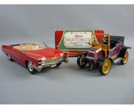 A SCHUCO CADILLAC AND OLD TIMER VEHICLE, boxed, plastic red convertible no. 5505, 'Made In Germany', 29 cms long and a tinpla