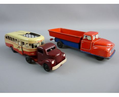 TWO GERMAN TINPLATE CLOCKWORK VEHICLES including a Heinrich Wimmer HWN-1950 bus, bakelite cab front unit with hook-on tinplat
