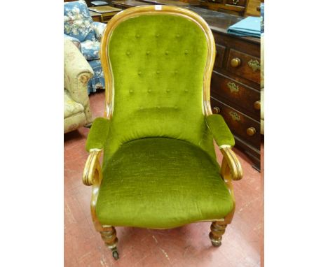 A MAHOGANY FRAMED VICTORIAN OPEN ARMCHAIR with green dralon button backed upholstery and on turned front supports