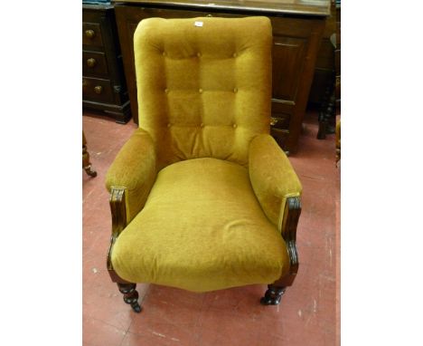 AN EDWARDIAN MAHOGANY ARMCHAIR, a button backed open armchair with turned front supports