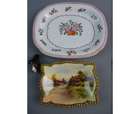 A NEAT OVAL NEWHALL DISH having a painted dot border with inner floral border and a centre basket of flowers, 19 cms long, a 