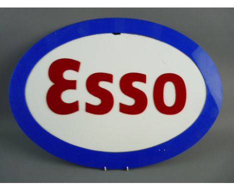 A PERSPEX OVAL ESSO GARAGE SIGN, 60 cms wide approximately (slight damage within the white area)
