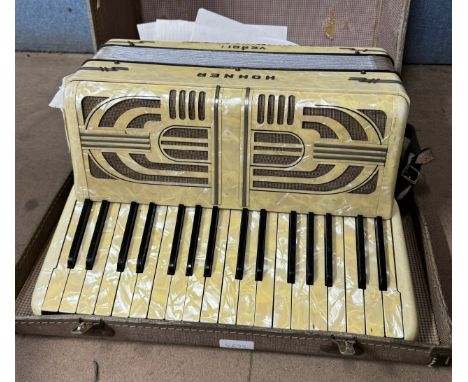 A cased Hohner Verdi accordion 