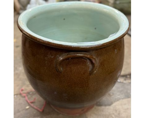 A salt glazed terracotta planter 