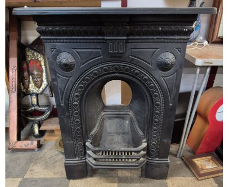 A Victorian cast iron fireplace 