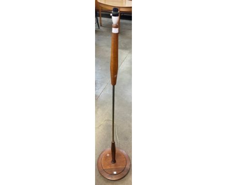 A teak standard lamp 