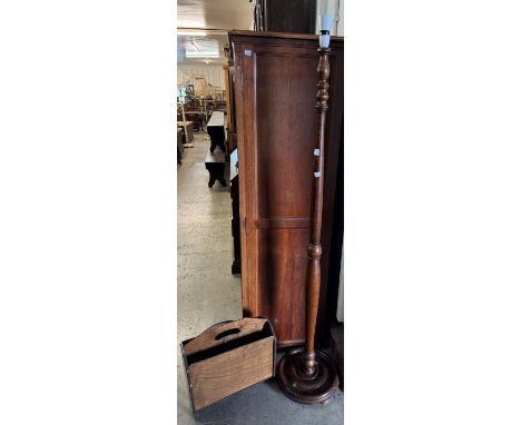 A mahogany standard lamp and magazine rack 