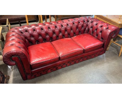 An Oxblood red Chesterfield three seater sofa/settee 