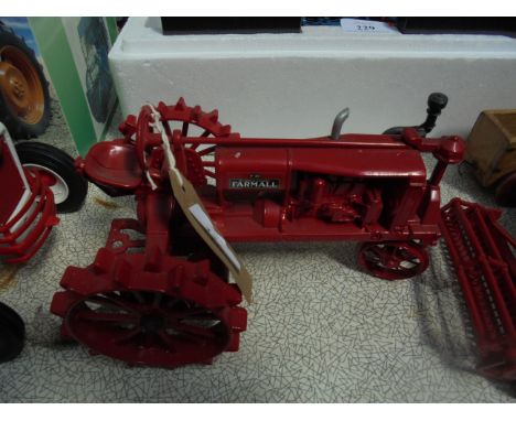 Model of Ertl McCormick Farmall tractor, spud wheels