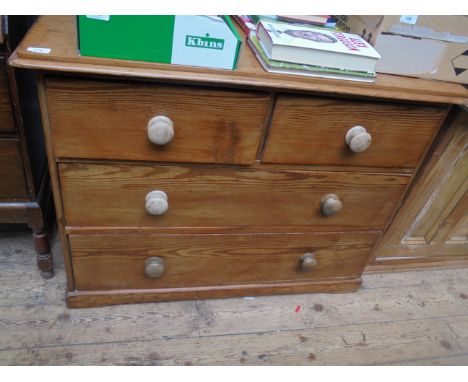 Polished pine chest of 2 short and 2 long drawers each with bobbin handles (40" wide)