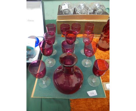 Set of 12 cranberry glass wine/port glasses together with carafe 