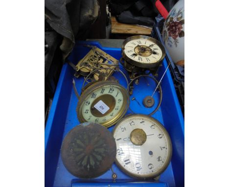 Selection of brass clock parts, enamel dials etc.