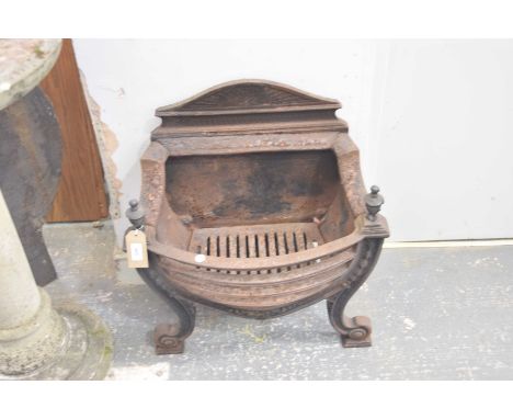 An Adams style cast iron fire basket
With an architectural back above two finials and a bowfront supported on two curvilinear