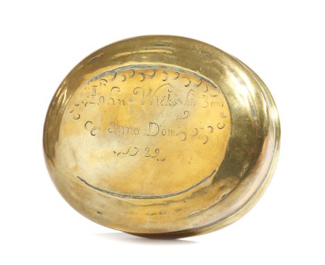 A GEORGE I BRASS OVAL SNUFF OR TOBACCO BOX DATED '1722' the pull-off cover inscribed 'John Wicks his box, anno Domi 1722' 9.8