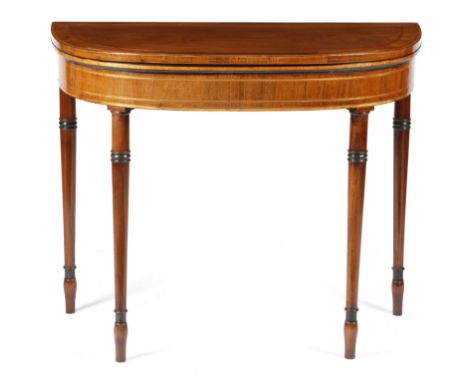 λ A REGENCY ROSEWOOD 'D' SHAPED CARD TABLE C.1810-15 inlaid with satinwood banding, the hinged top on twin gate supports, rev