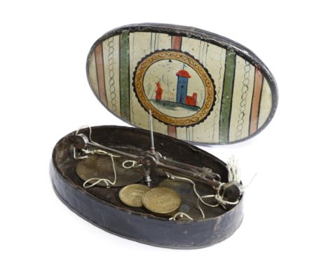 A PAINTED TOLE CASED SET OF COIN BALANCE SCALES POSSIBLY WELSH, PONTYPOOL black japanned, the lid naively decorated with colo