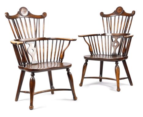 A PAIR OF ARTS AND CRAFTS BEECH AND ELM WINDSOR STYLE ARMCHAIRS LATE 19TH / EARLY 20TH CENTURY each with a rondel decorated c