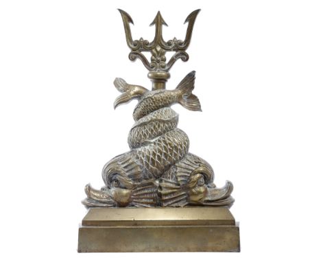 A BRASS DOORSTOP PROBABLY 19TH CENTURY in the form of a pair of entwined dolphins and with a trident handle 45cm high, 30.6cm