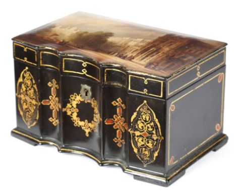 A VICTORIAN PAPIER-MACHE TEA CADDY C.1860 with a serpentine front decorated with gilt lines and Celtic designs, the hinged li