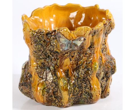 A large and unusual Bretby jardiniere in the form tree trunk with butterflies, moths and snail decoration, impressed to base 