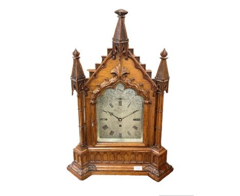 A 19th century oak cased Gothic bracket/table clock by James Gowland 52 London Wall City, the silvered dial with Roman numera