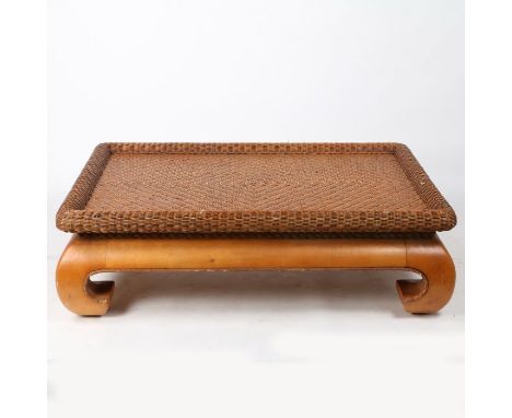 A Mid 20th century wicker and oriental hardwood coffee table in the Chinese taste, having a rectangular wicker top with a rai