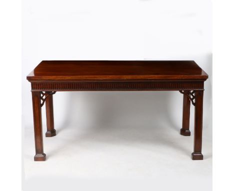 A 18th century mahogany serving table, with a rectangular top above a thumb moulded frieze raised on architectural inset legs