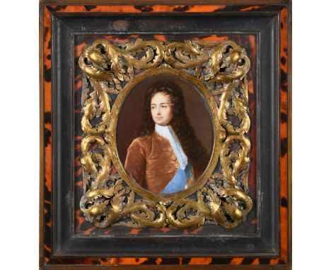 Circle of Samuel Cooper (c.1608-1672) Portrait of a gentleman, half length, wearing a white lace cravat, brown jacket and blu