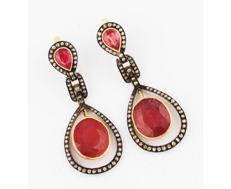 A pair of modern ruby and diamond Art Deco style earrings, each featuring an oval rose cut ruby dropper, measuring approx. 17