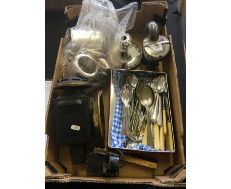 A carton of items to include silver plated tea set, 19th Century spoon warmer, candle stick, cutlery, converted railway lamp 