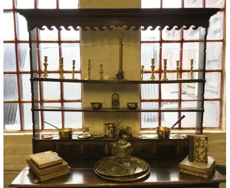 A collection of brassware items to include candle sticks including mid 19th Century pair, some A/F, kettle, lamp, bowls, plat
