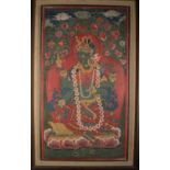 A PAINTING OF GREEN TARA ON A TORTOISE THRONE
