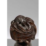 NETSUKE OF AN OCTOPUS ENTWINDED AROUND A TURTLE
