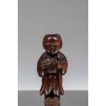NETSUKE OF A BOY HOLDING A TORTOISE