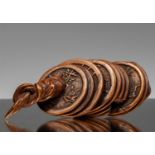 NETSUKE OF A STRING OF CASH COINS
